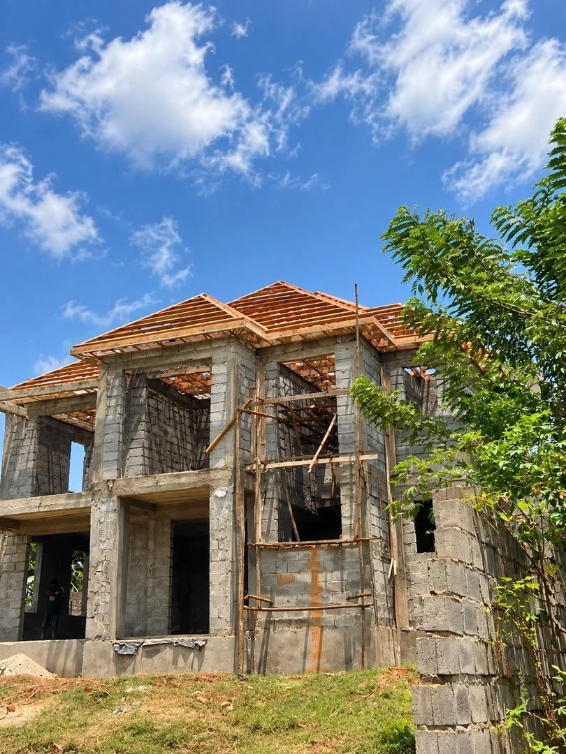 Masonry and structural work at a residential building site.